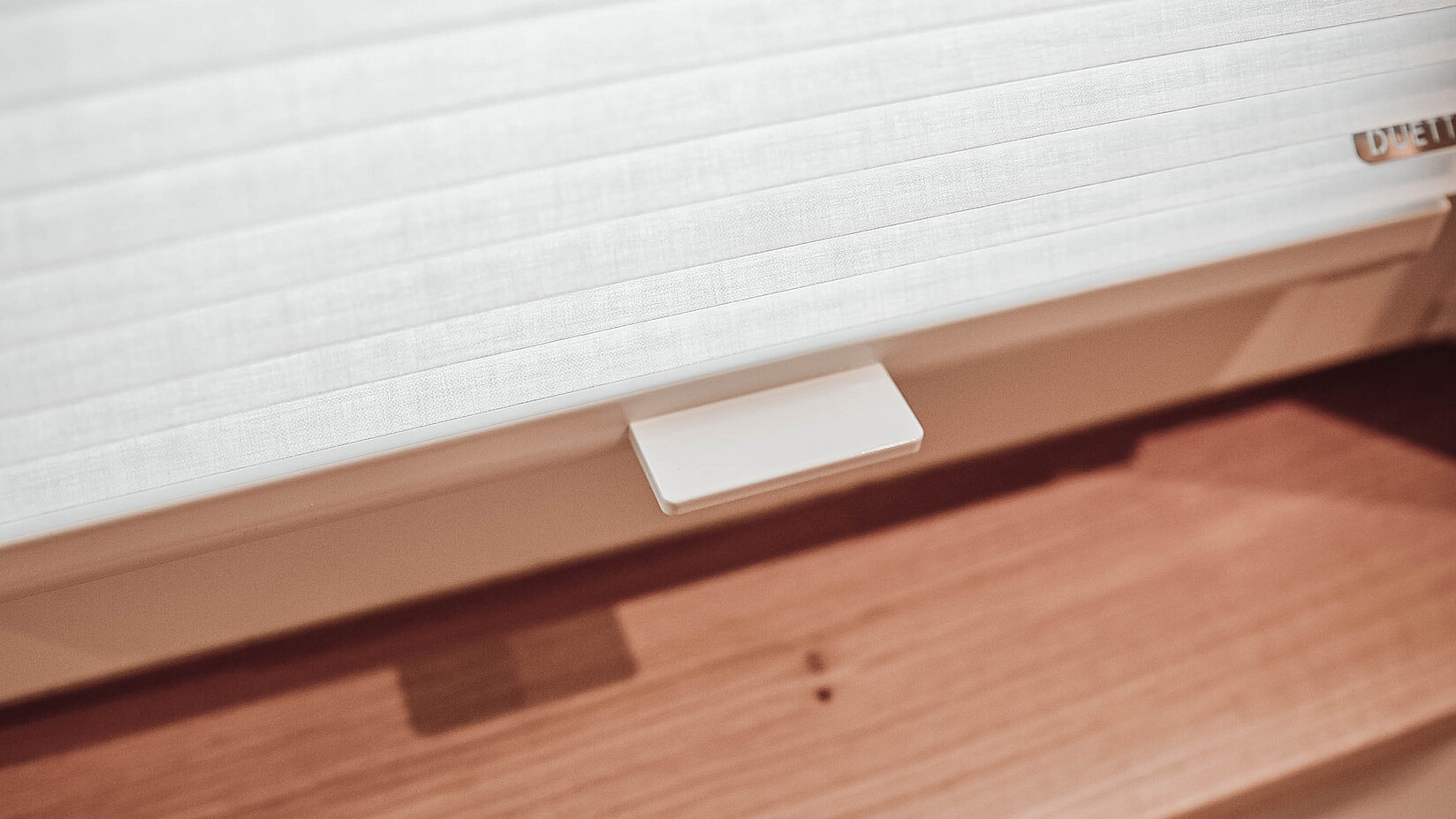 [Translate to Französisch:] Plissees der Kooperation im Badezimmer