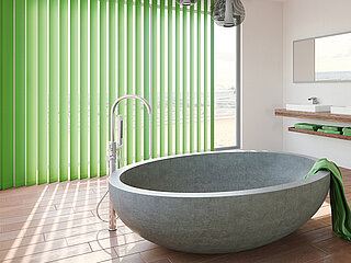 Badezimmer mit runder freistehender Steinbadewanne, grünem Lamellenvorhang am Fenster und Naturlicht